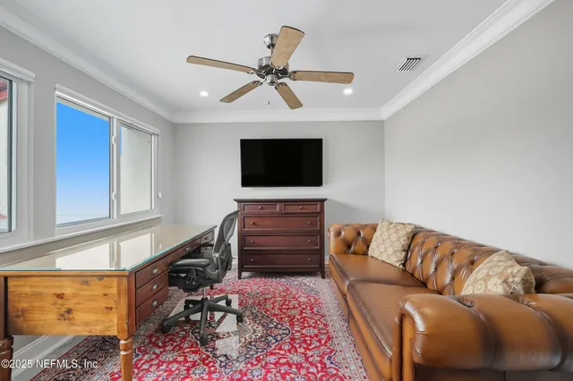 an aerial view of a house with swimming pool patio and outdoor seating