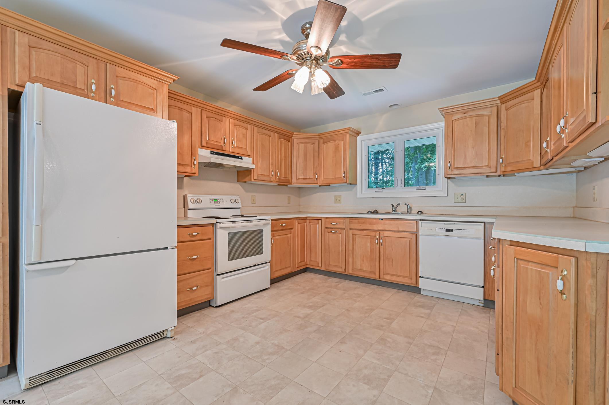 202 Highway 40 Carneys Point, NJ 08069 - Photo 4 of 9 a kitchen with stainless steel appliances granite countertop a refrigerator sink and cabinets