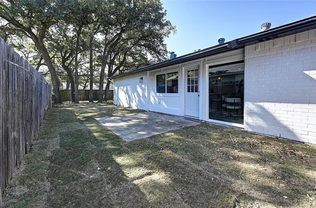 a view of a backyard of the house