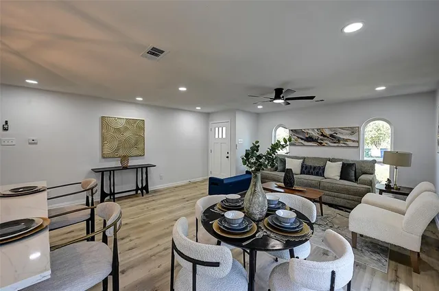 a living room with furniture and a table