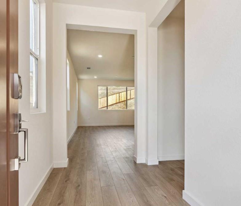 8094 Waterfall Lane Vallejo, CA 94591 - Photo 2 of 13 a view of a room with wooden floor and windows