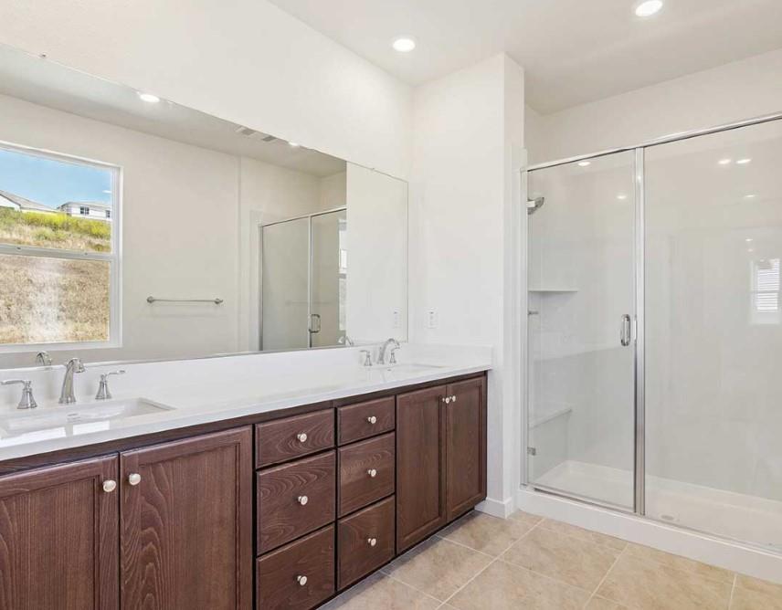 8094 Waterfall Lane Vallejo, CA 94591 - Photo 9 of 13 a spacious bathroom with double sink and a mirror