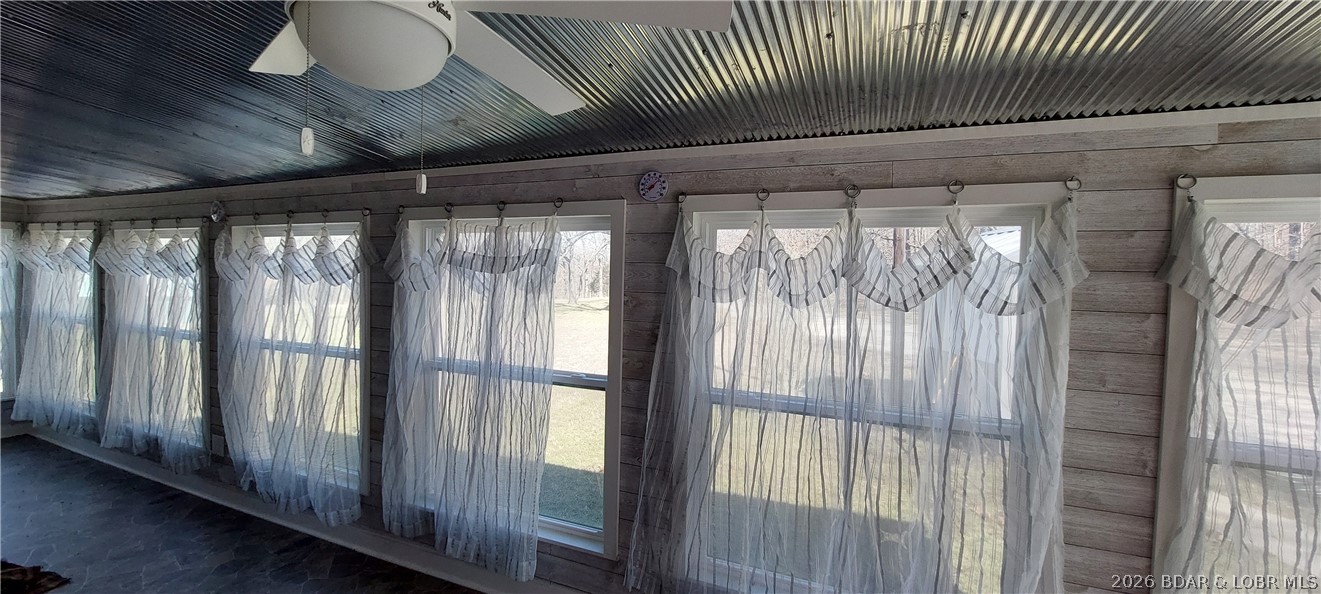 15563 Peach Tree Road Stover, MO 65078 - Photo 25 of 69 Wall of vinyl windows in the sunroom, great for vi