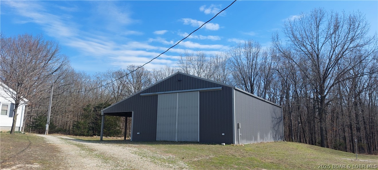 15563 Peach Tree Road Stover, MO 65078 - Photo 30 of 69 shop with lean to
