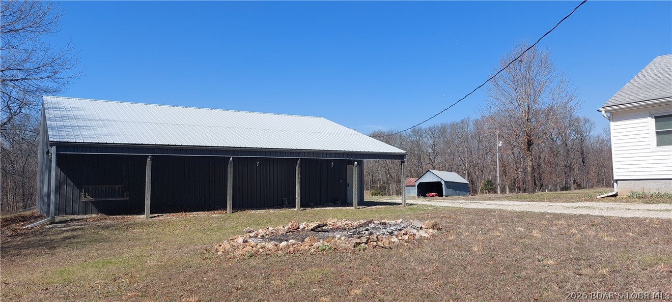 15563 Peach Tree Road Stover, MO 65078 - Photo 33 of 69 Shop and fire pit