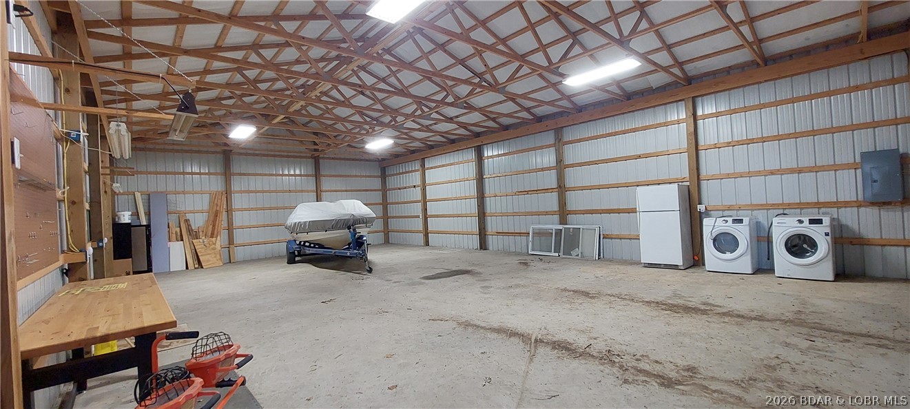 15563 Peach Tree Road Stover, MO 65078 - Photo 34 of 69 Inside the large shop with concrete floor