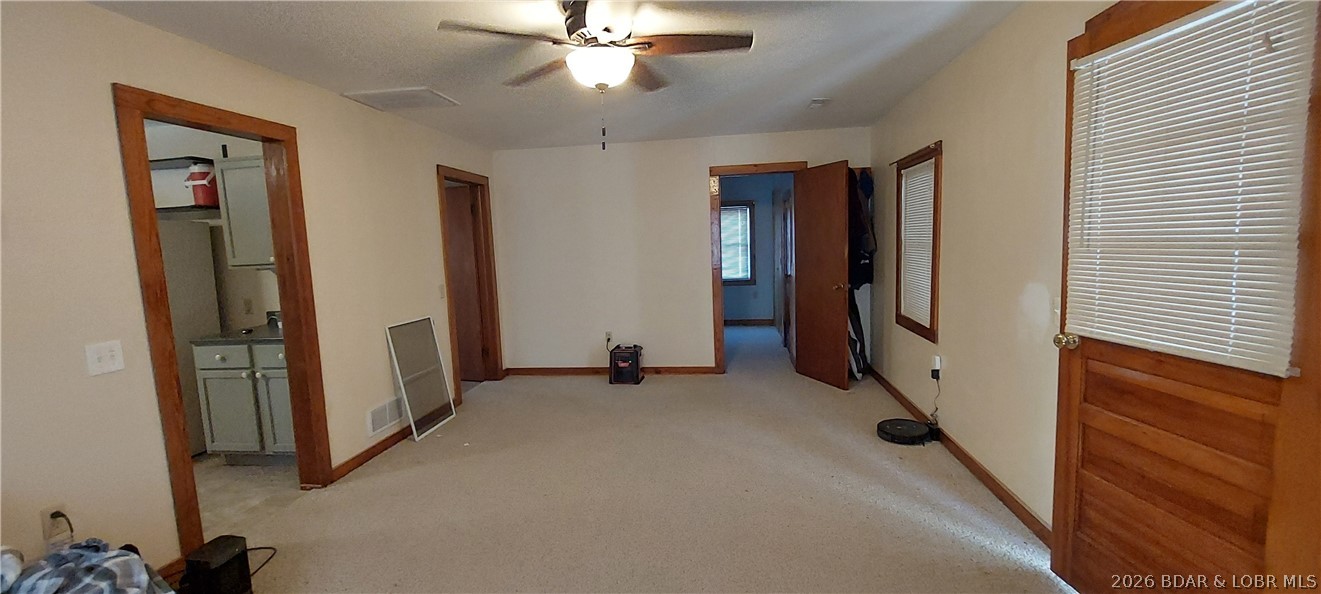 15563 Peach Tree Road Stover, MO 65078 - Photo 9 of 69 Living room, sunroom door on right, kitchen on lef
