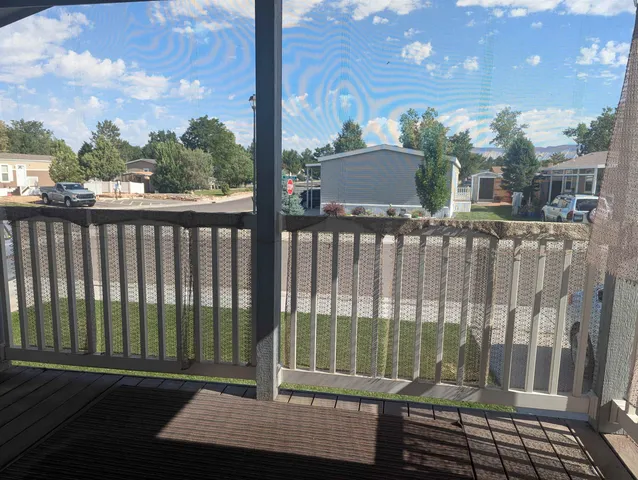 a view of a balcony with a floor to ceiling window