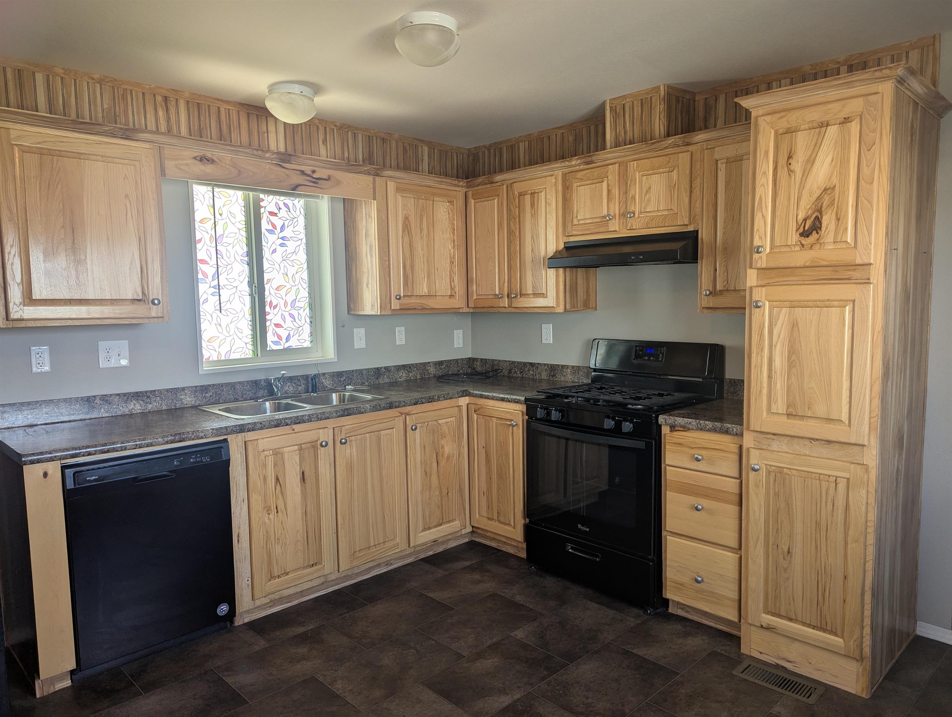 435 32 Road, Unit 53 Clifton, CO 81520 - Photo 7 of 24 a kitchen with stainless steel appliances granite countertop a stove and a sink