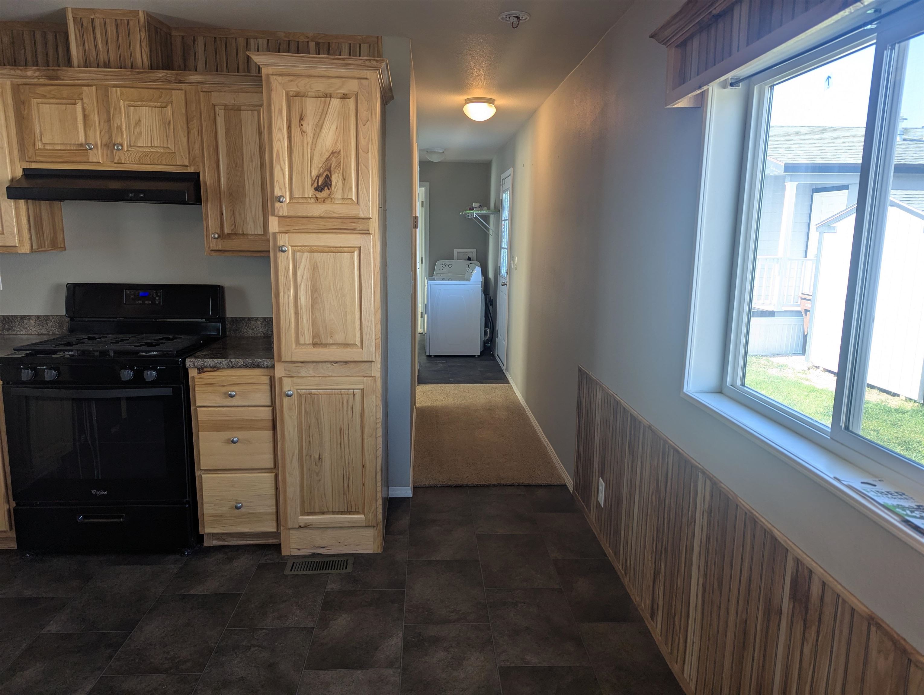 435 32 Road, Unit 53 Clifton, CO 81520 - Photo 10 of 24 a kitchen with white cabinets and black appliances