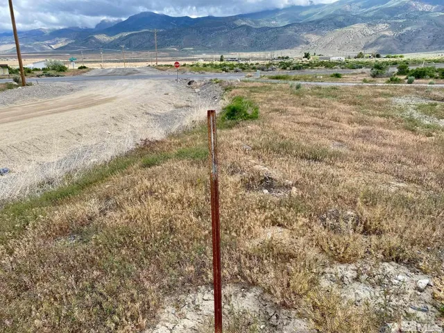 a view of a road with an ocean beach