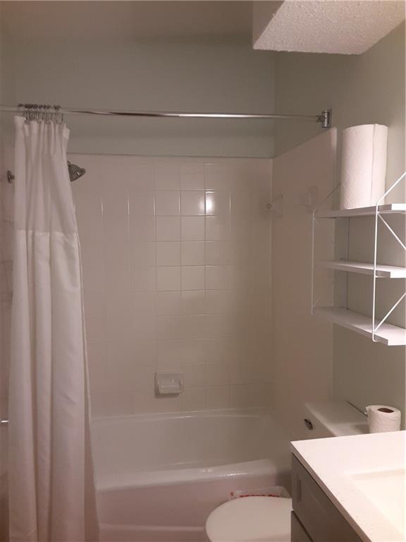 2408 Longview Street, Unit 212 Austin, TX 78705 - Photo 11 of 15 a bathroom with a bathtub and a shower