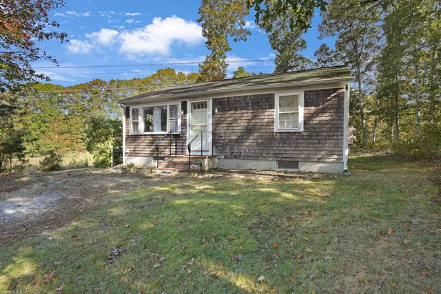 a front view of a house with a yard