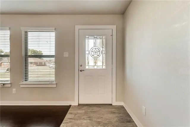 a view of an empty room and window
