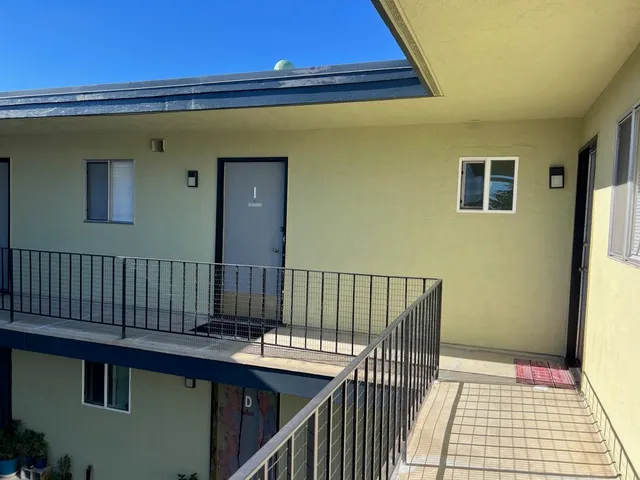 a view of balcony with wooden floor