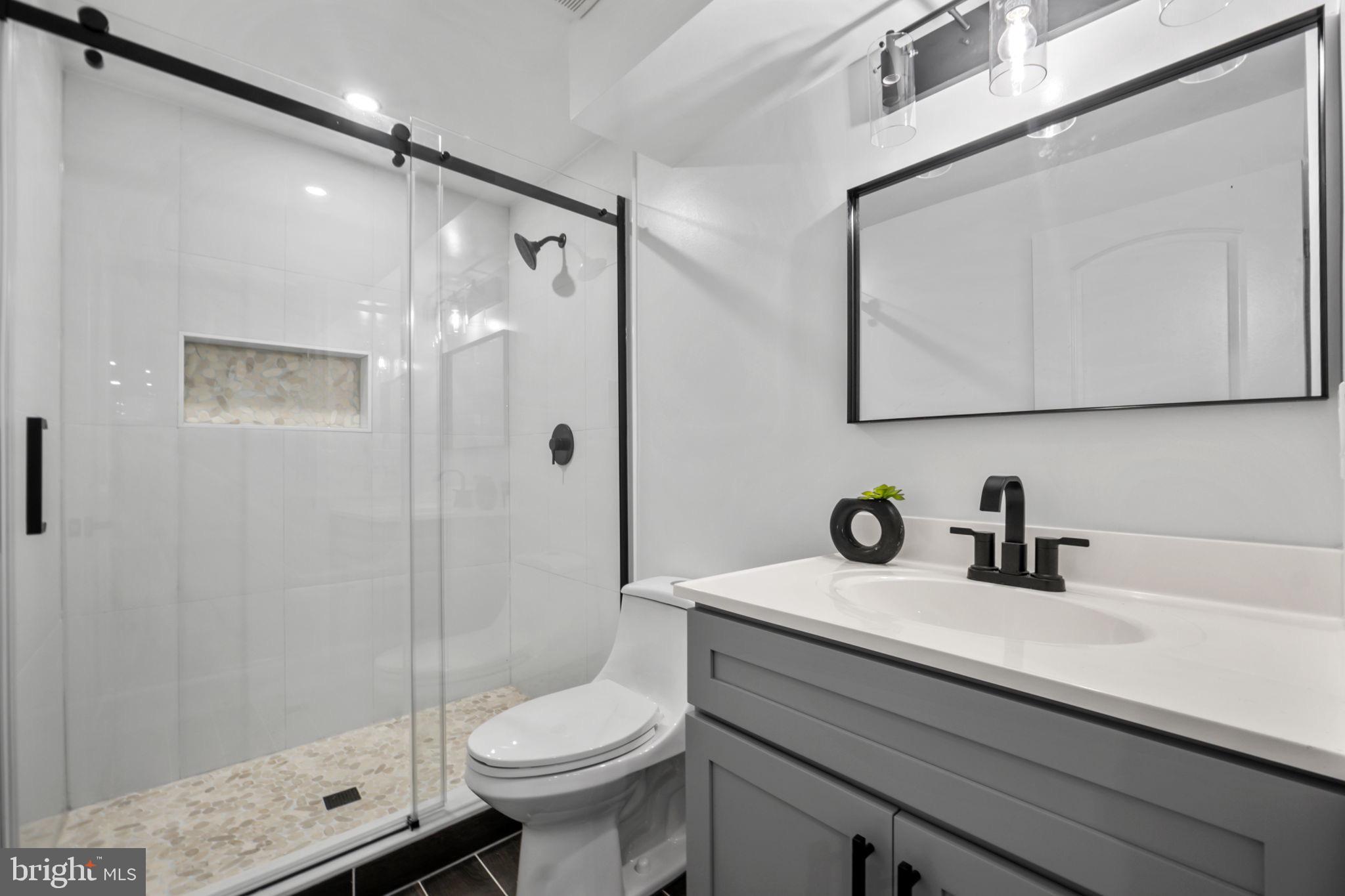 1611 Dayton Road Hyattsville, MD 20783 - Photo 21 of 54 Sleek modern bathroom with elegant finishes.