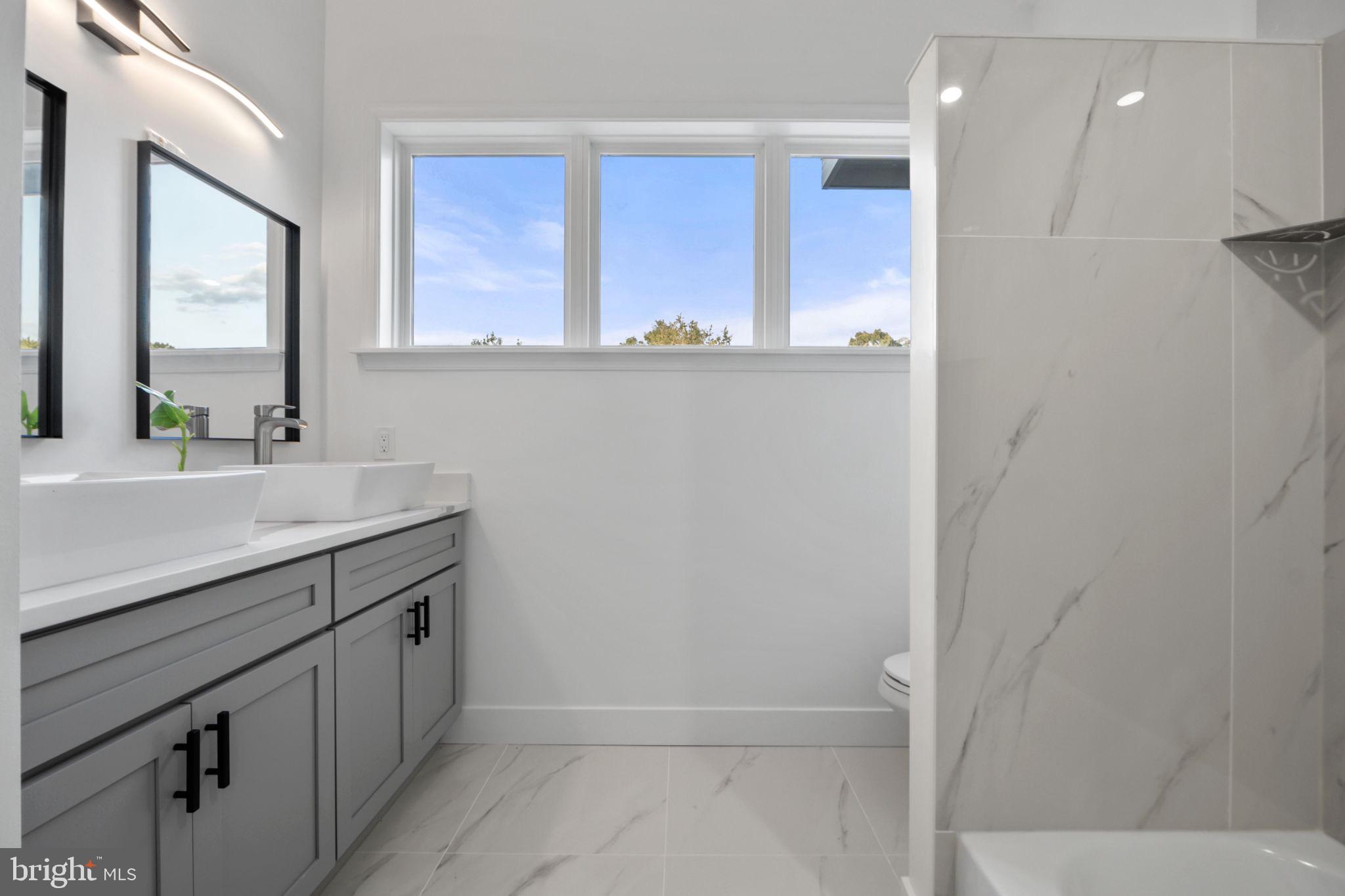 1611 Dayton Road Hyattsville, MD 20783 - Photo 22 of 54 Bright and airy modern bathroom retreat.
