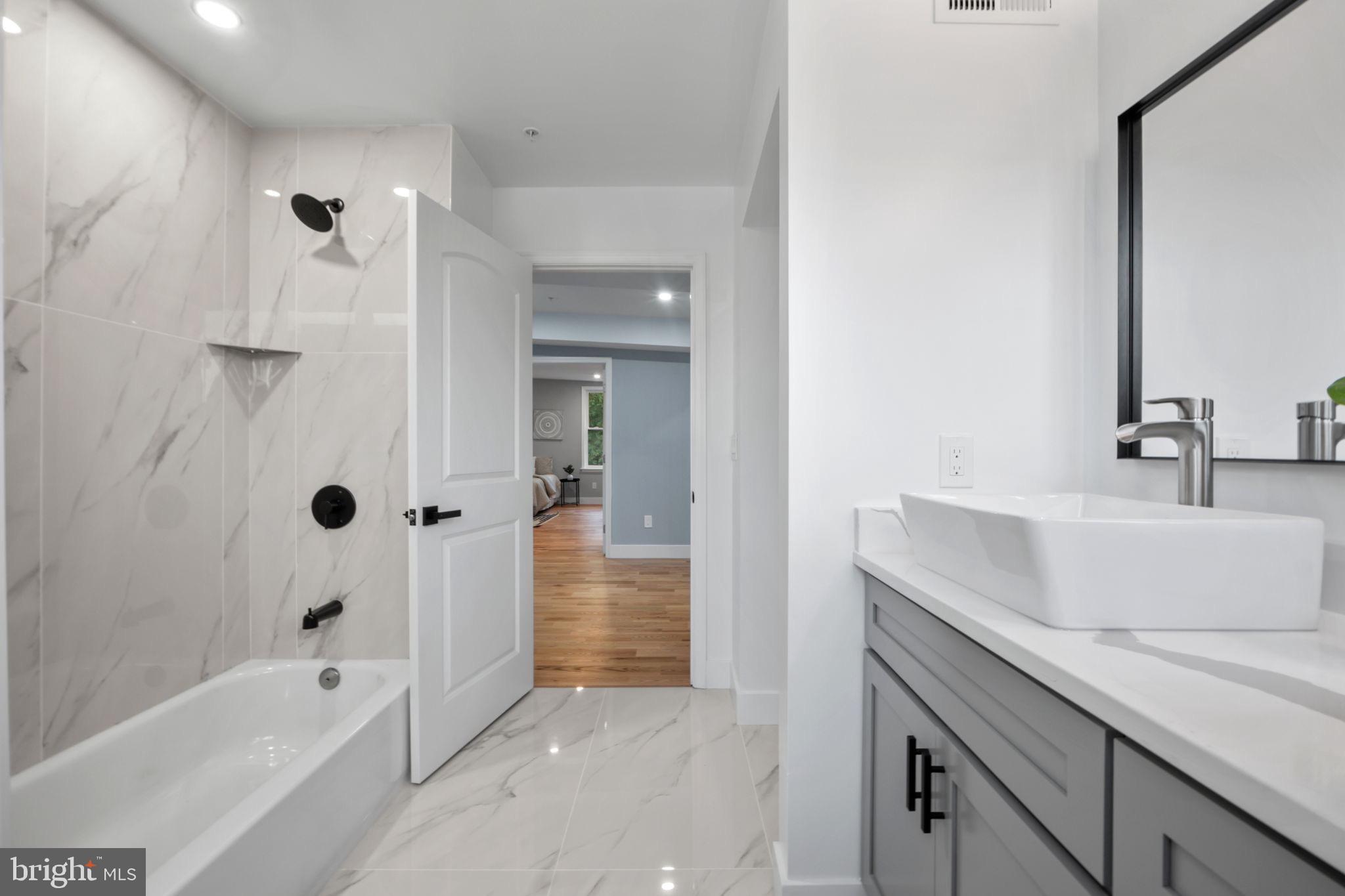 1611 Dayton Road Hyattsville, MD 20783 - Photo 24 of 54 Sleek modern bathroom with elegant finishes.