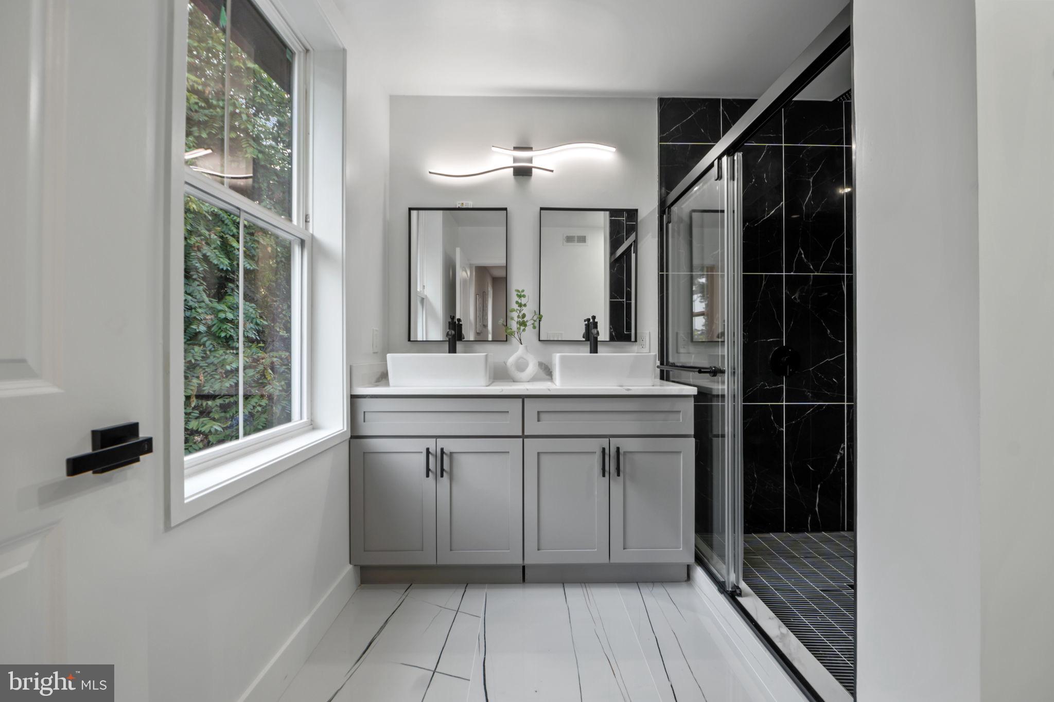 1611 Dayton Road Hyattsville, MD 20783 - Photo 31 of 54 Sleek modern bathroom with elegant finishes.