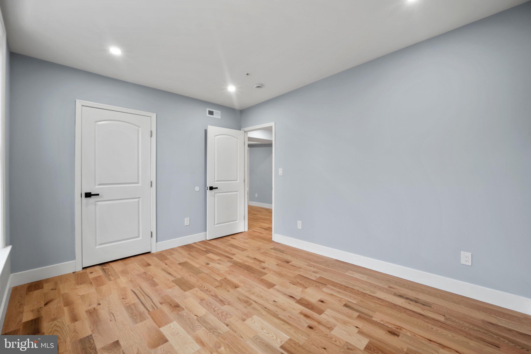 1611 Dayton Road Hyattsville, MD 20783 - Photo 33 of 54 Spacious room with soft blue walls.
