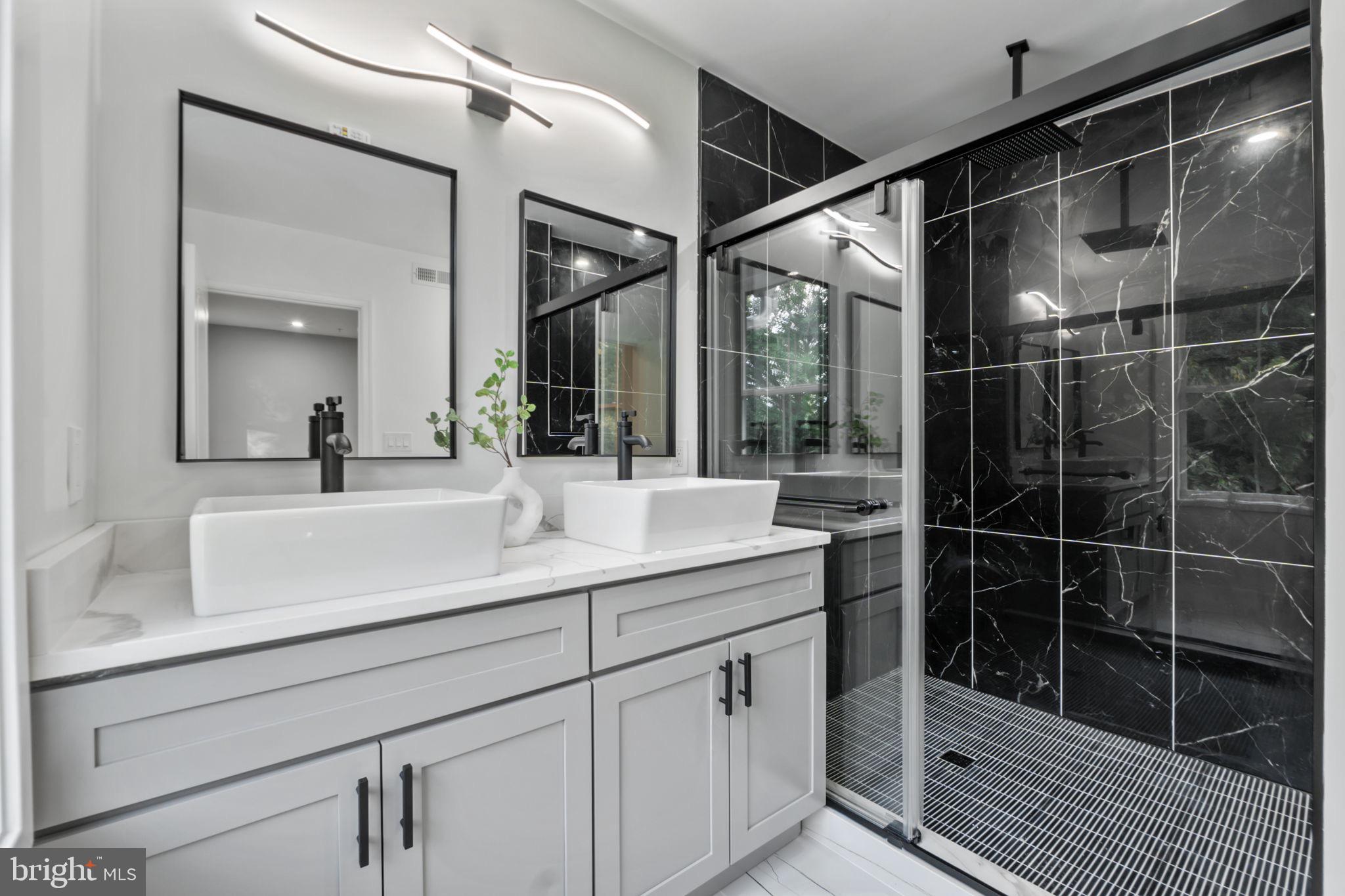 1611 Dayton Road Hyattsville, MD 20783 - Photo 39 of 54 Sleek modern bathroom with elegant finishes.