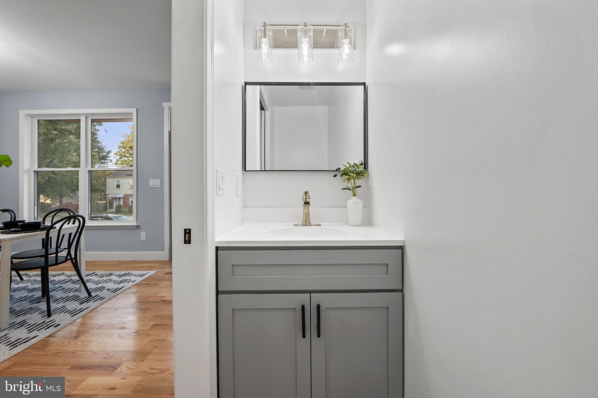 1611 Dayton Road Hyattsville, MD 20783 - Photo 42 of 54 Sleek modern bathroom with elegant fixtures.