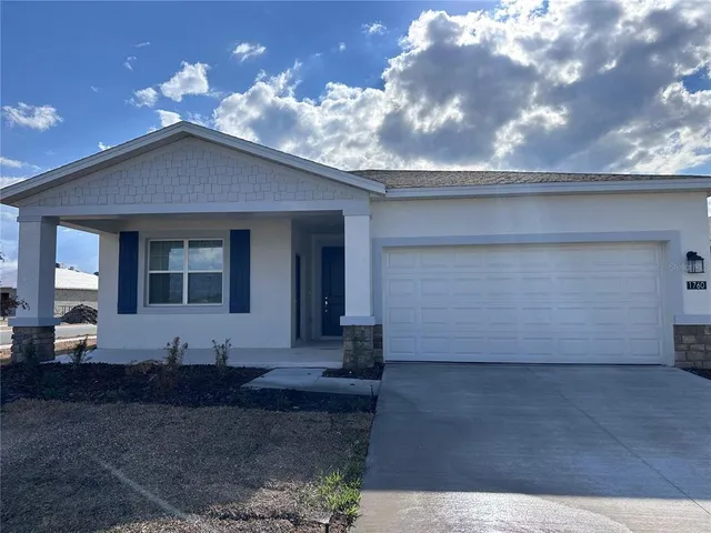 a view of a house with a patio