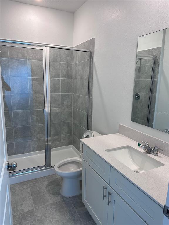 1760 Foreman Road Eagle Lake, FL 33839 - Photo 13 of 22 a bathroom with a sink toilet and shower