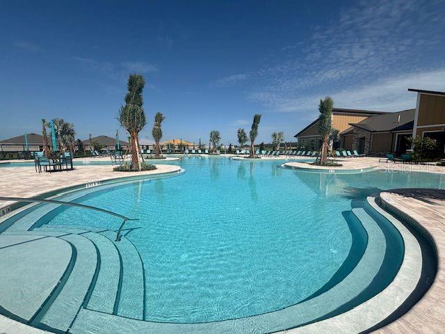 1760 Foreman Road Eagle Lake, FL 33839 - Photo 17 of 22 a view of a swimming pool with outdoor seating