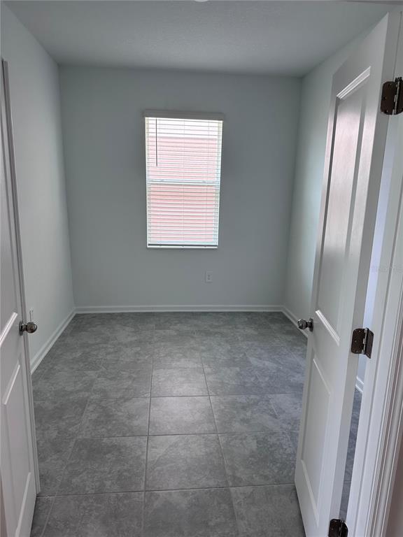 1760 Foreman Road Eagle Lake, FL 33839 - Photo 5 of 22 a view of an empty room with a window