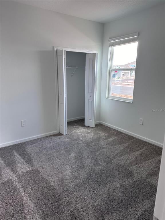 1760 Foreman Road Eagle Lake, FL 33839 - Photo 7 of 22 an empty room with windows