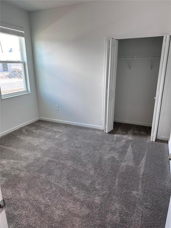 1760 Foreman Road Eagle Lake, FL 33839 - Photo 8 of 22 an empty room with windows