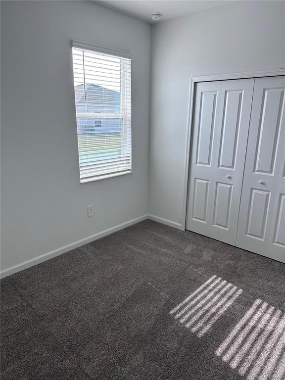 1760 Foreman Road Eagle Lake, FL 33839 - Photo 9 of 22 a view of wooden floor and closet in a room