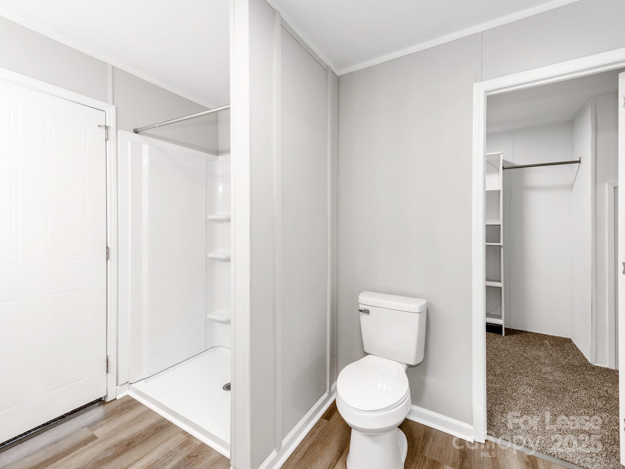 1219 Foxlaire Drive Denver, NC 28037 - Photo 13 of 30 a bathroom with a toilet and a shower