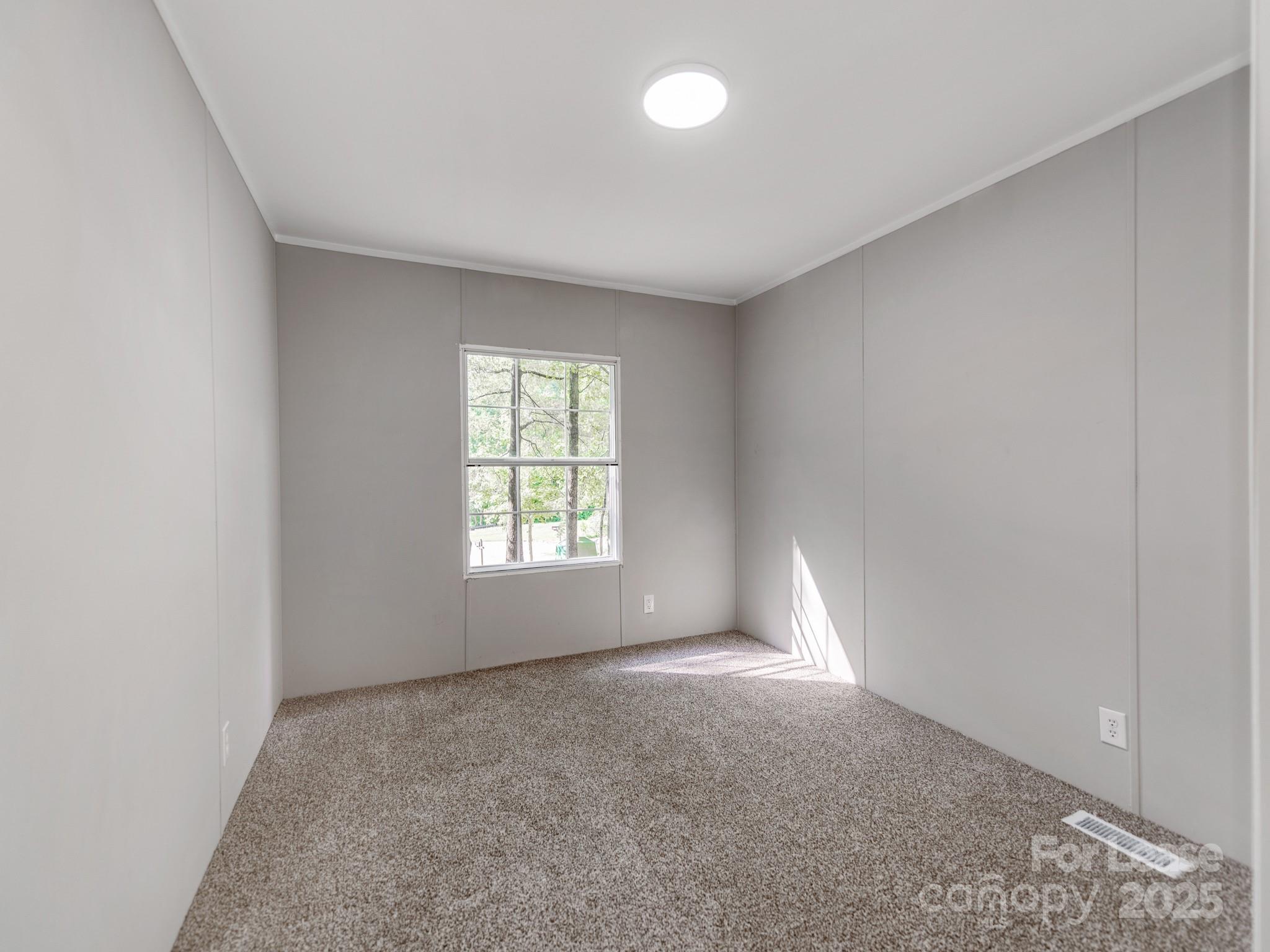 1219 Foxlaire Drive Denver, NC 28037 - Photo 15 of 30 an empty room with a window