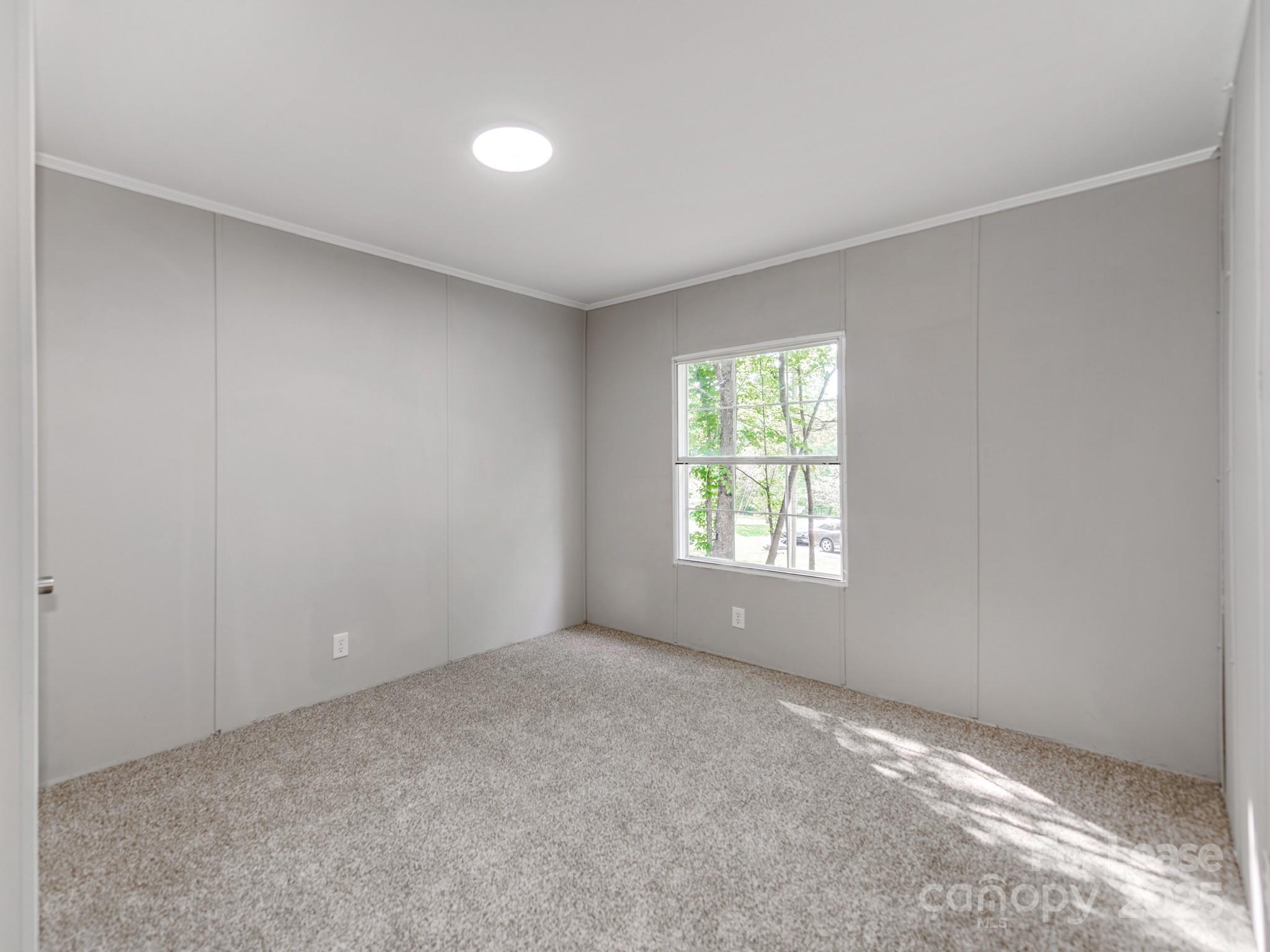 1219 Foxlaire Drive Denver, NC 28037 - Photo 17 of 30 a view of an empty room with a window