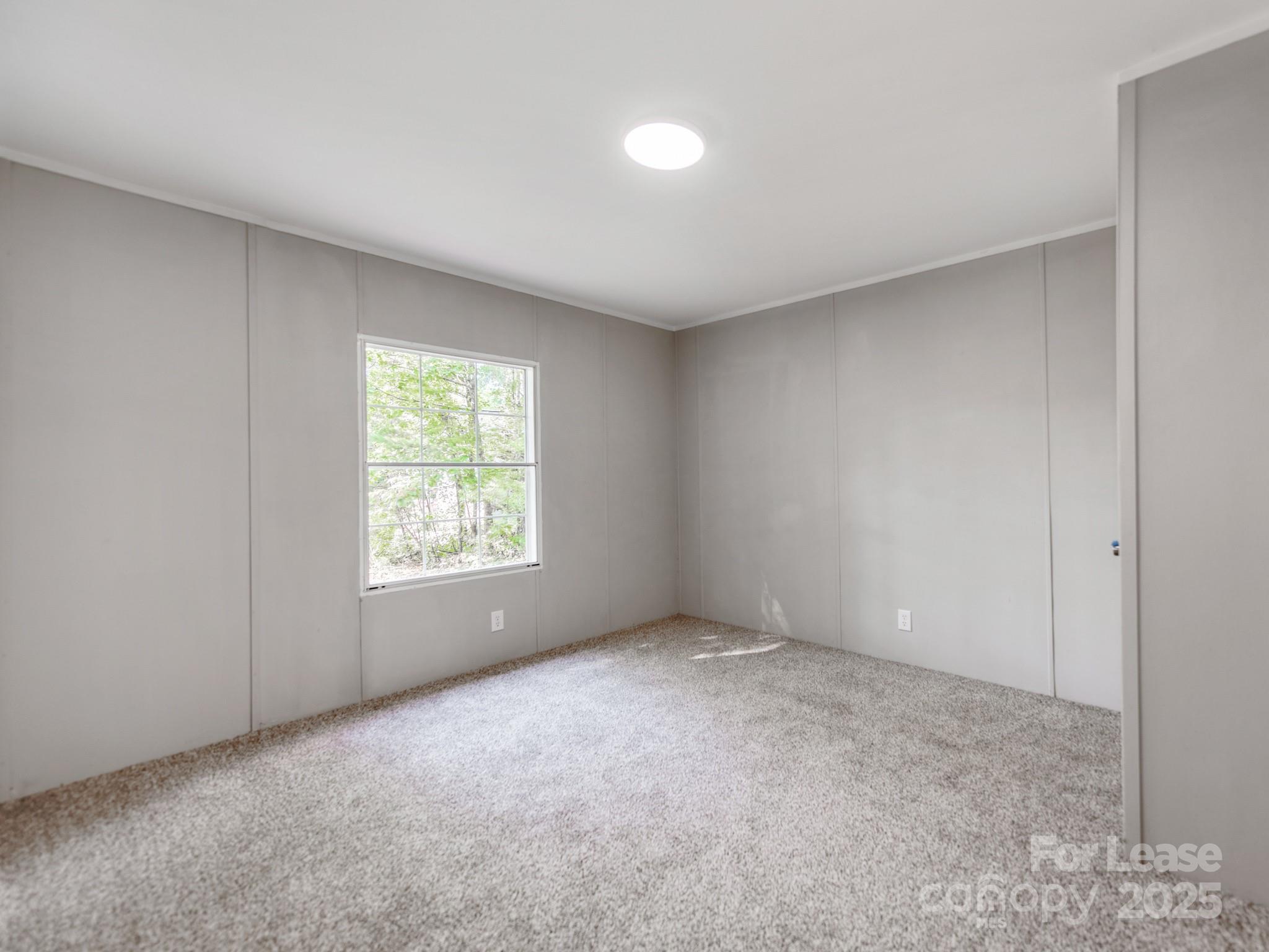 1219 Foxlaire Drive Denver, NC 28037 - Photo 20 of 30 a view of an empty room with a window