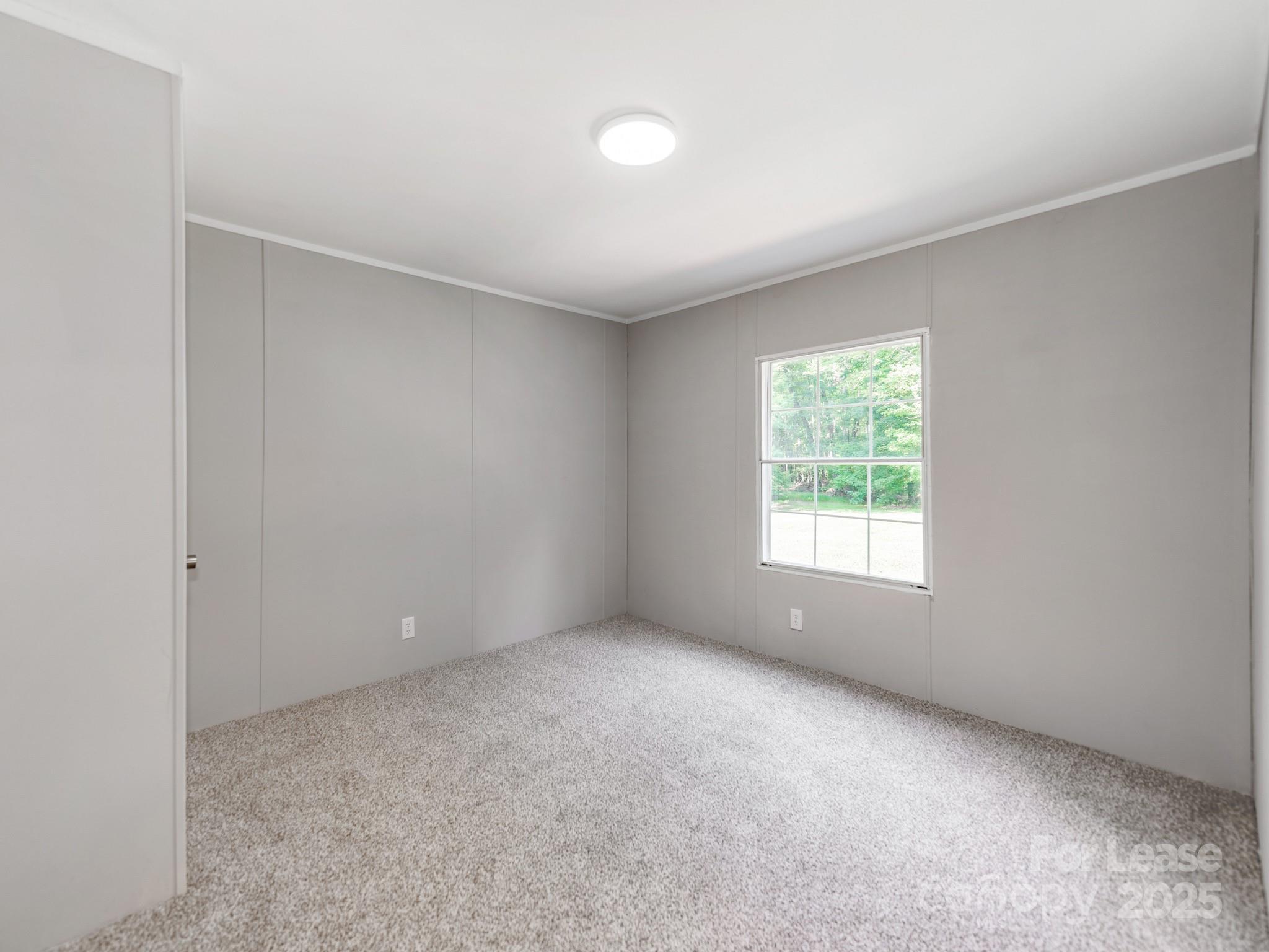 1219 Foxlaire Drive Denver, NC 28037 - Photo 24 of 30 an empty room with a window