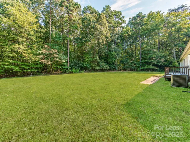 a view of a balcony with wooden floor