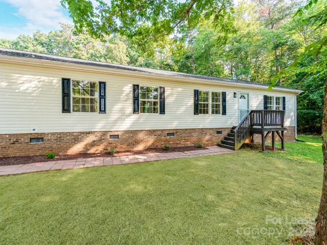 a backyard of a house with seating space