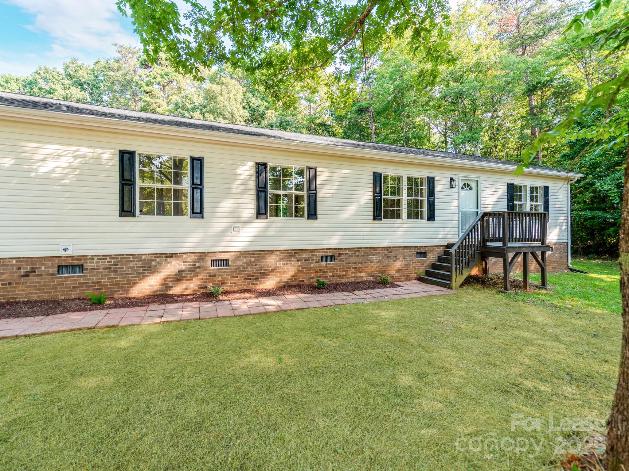 1219 Foxlaire Drive Denver, NC 28037 - Photo 3 of 30 a backyard of a house with seating space