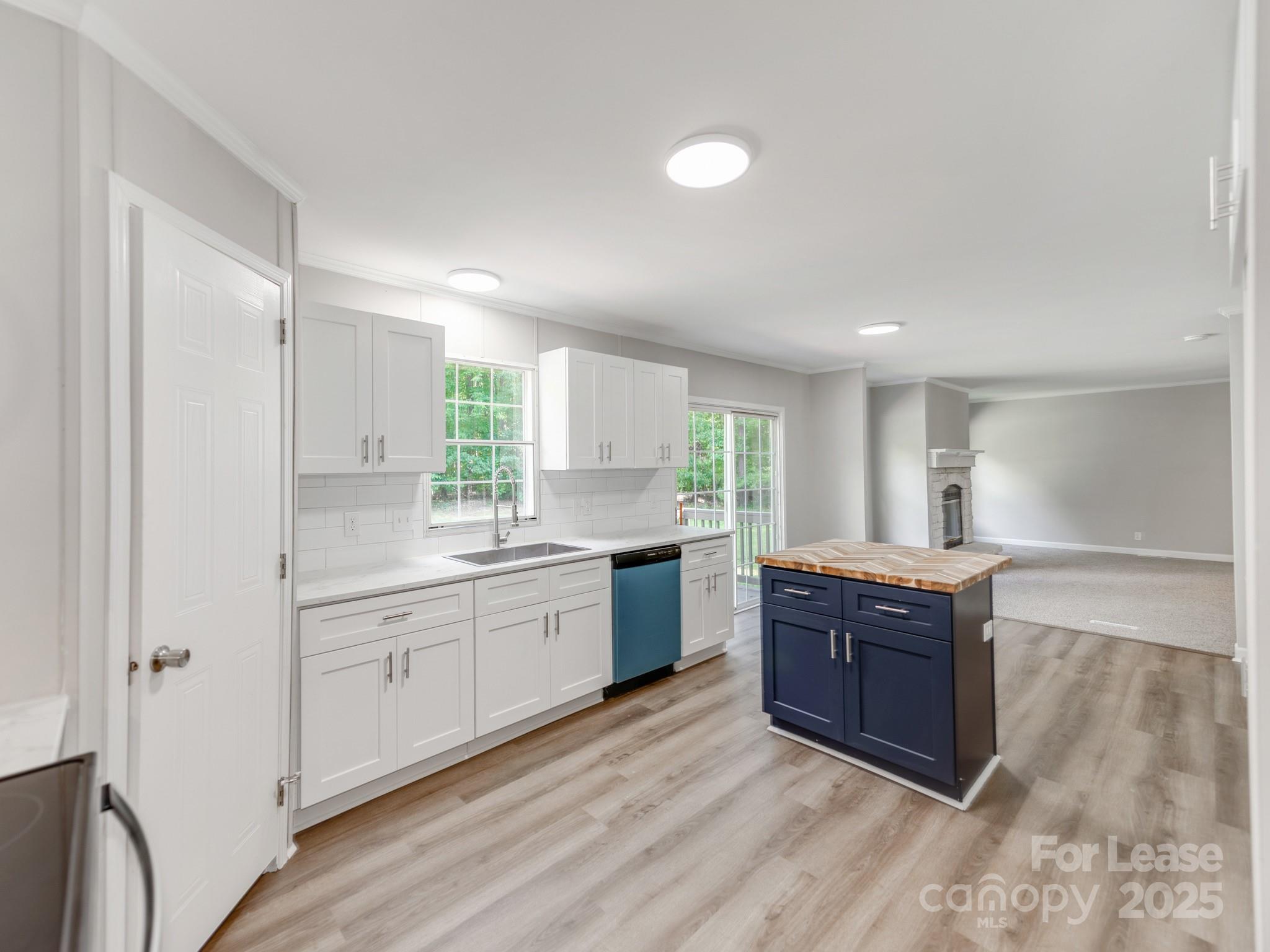 1219 Foxlaire Drive Denver, NC 28037 - Photo 9 of 30 a large bathroom with a granite countertop double vanity sink a mirror and a bathtub