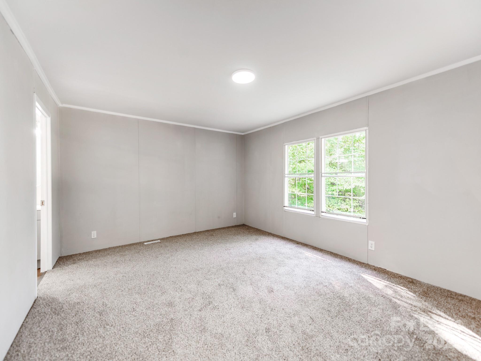 1219 Foxlaire Drive Denver, NC 28037 - Photo 10 of 30 an empty room with a window