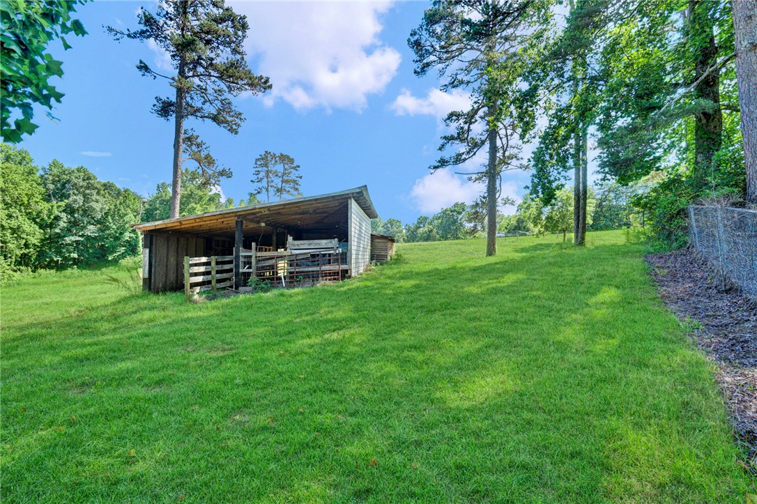 7876 Highway 11 Walhalla, SC 29691 - Photo 32 of 35 A rustic barn and verdant pasture await your agricultural dreams.