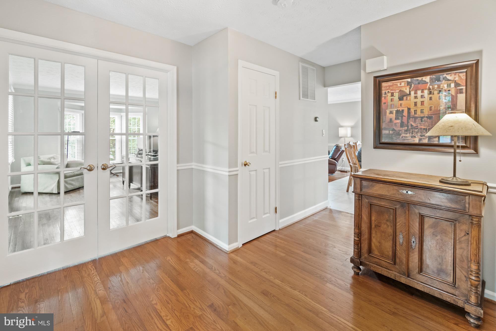 17247 Spates Hill Road Poolesville, MD 20837 - Photo 36 of 90 Foyer looking into glass-doored office/living room