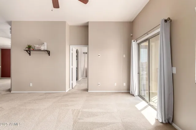 a view of kitchen with furniture and a ceiling fan