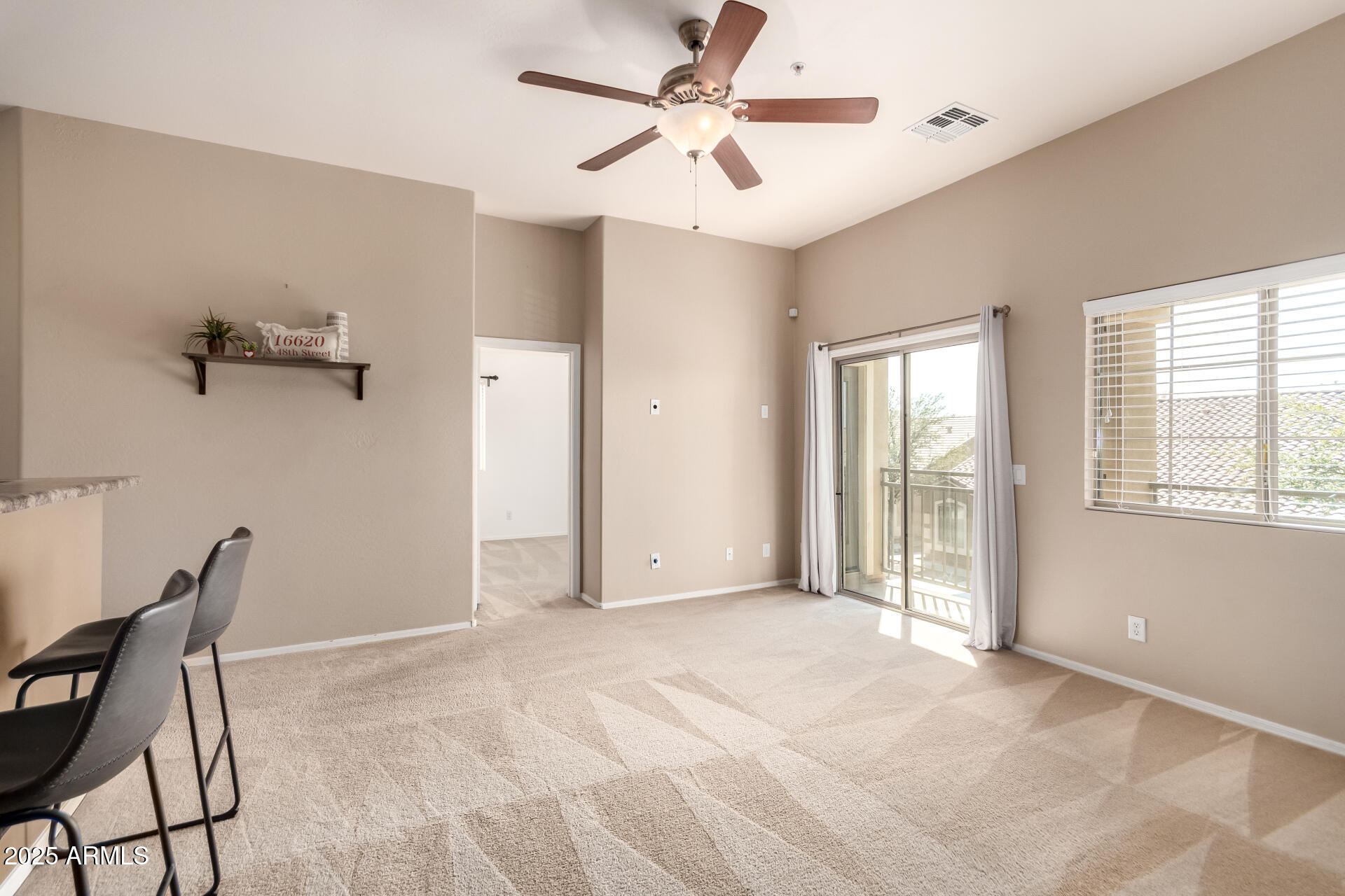 16620 South 48th Street, Unit 70 Phoenix, AZ 85048 - Photo 15 of 36 a view of a livingroom with a windows and ceiling fan