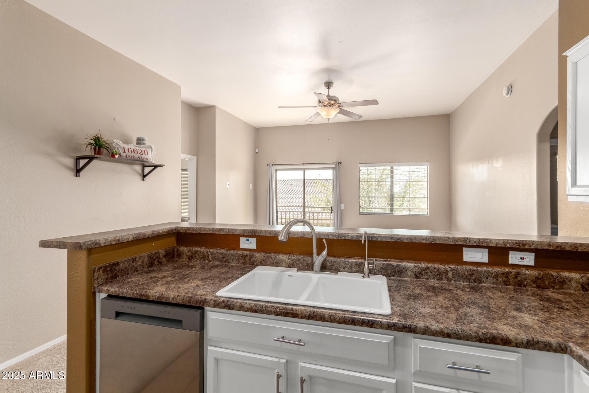 16620 South 48th Street, Unit 70 Phoenix, AZ 85048 - Photo 17 of 36 a bathroom with a granite countertop sink and a mirror