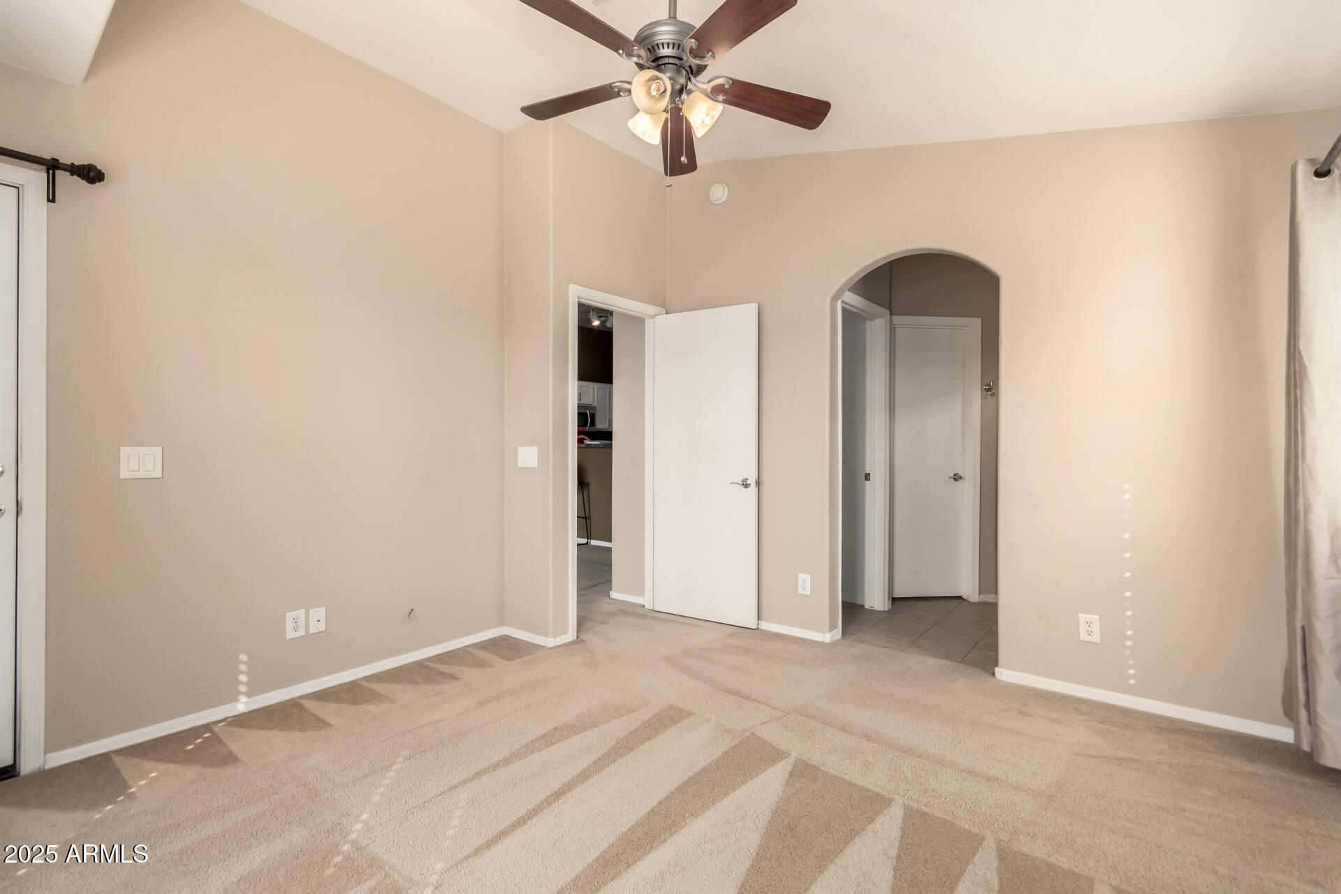 16620 South 48th Street, Unit 70 Phoenix, AZ 85048 - Photo 21 of 36 an empty room with closet and a chandelier fan