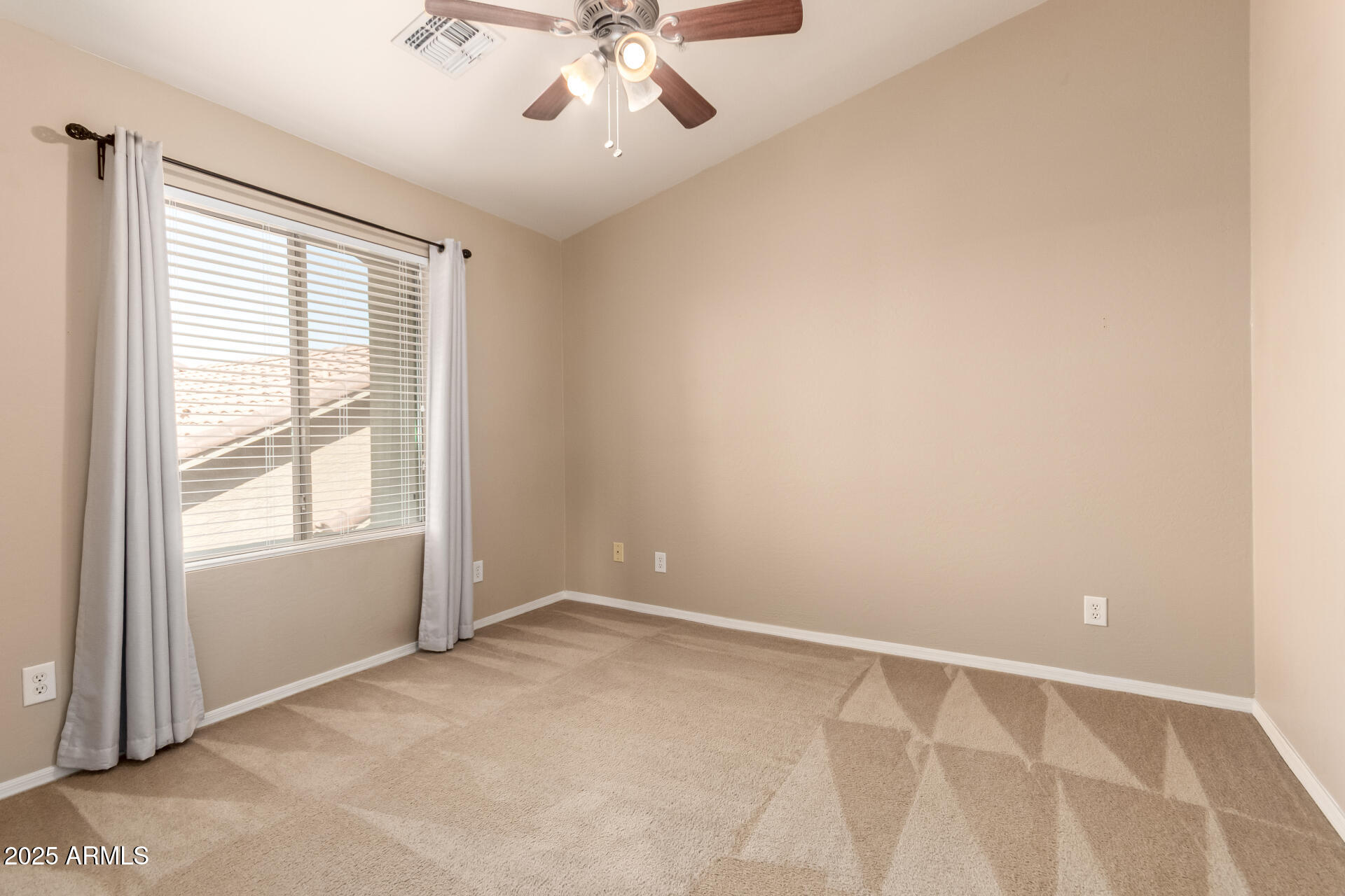 16620 South 48th Street, Unit 70 Phoenix, AZ 85048 - Photo 24 of 36 an empty room with a window